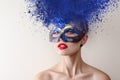 Fashion model with carnival mask