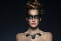 Fashion model with creative dark make up and copyspace