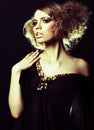 Fashion model with curly hair in black tunic Royalty Free Stock Photo