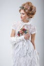 Fashion Model in Flossy White Dress and Wreath of Flowers