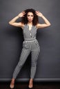 Fashion Model girl full length portrait isolated on gray background. Beauty stylish brunette woman posing in fashionable Royalty Free Stock Photo