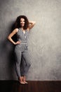 Fashion Model girl full length portrait isolated on gray background. Beauty stylish brunette woman posing in fashionable Royalty Free Stock Photo