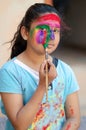 Fashion Model Girl colorful face paint. Beauty fashion art portrait of beautiful woman girl with flowing liquid paint holi, Royalty Free Stock Photo