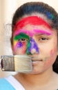 Fashion Model Girl colorful face paint. Beauty fashion art portrait of beautiful woman girl with flowing liquid paint holi, Royalty Free Stock Photo