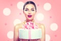 Fashion model girl holding beautiful party or birthday cake