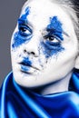 Fashion model girl portrait with colorful powder make up. woman with bright blue makeup and white skin. Abstract fantasy Royalty Free Stock Photo