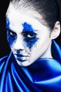 Fashion model girl portrait with colorful powder make up. woman with bright blue makeup and white skin. Abstract fantasy Royalty Free Stock Photo