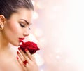 Fashion model girl with red rose in her hand Royalty Free Stock Photo