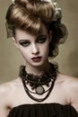 Fashion model with gothic makeup and black jewelry Royalty Free Stock Photo