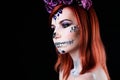 Fashion model with halloween skull makeup with glitter and rhinestones