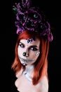 Fashion model with halloween skull makeup with glitter and rhinestones