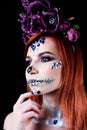 Fashion model with halloween skull makeup with glitter and rhinestones