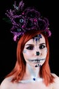 Fashion model with halloween skull makeup with glitter and rhinestones