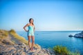 Fashion model in lace dress outside posing ,yahts on background Royalty Free Stock Photo