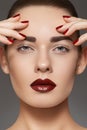 Fashion model with lips make-up, manicure on nails Royalty Free Stock Photo