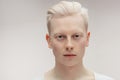 Fashion model male on white. Handsome albino guy closeup. Royalty Free Stock Photo