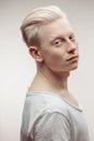 Fashion model male on white. Handsome albino guy closeup. Royalty Free Stock Photo