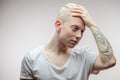 Fashion model male on white. Handsome albino guy closeup. Royalty Free Stock Photo