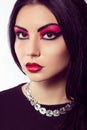 Fashion model portrait. Scarlet makeup. Black arrows. Royalty Free Stock Photo