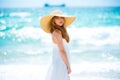 Fashion model posing on the beach. Summer dress fashionable woman clothes. Young beautiful hipster woman on tropical Royalty Free Stock Photo