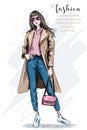 Fashion model posing. Beautiful young woman in coat. Fashion woman with bag. Hand drawn girl in sunglasses. Sketch. Royalty Free Stock Photo