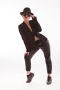 Fashion model posing curving her body wearing a stylish jacket in studio over white background Royalty Free Stock Photo