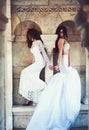 Fashion model or princess in dress. Bride girls at wedding ceremony in castle. Sexy girls in white dress with stylish