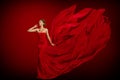 Fashion Model Red Flaming Dress, Woman in Long Fluttering Waving Gown Tail, Young Girl Beauty Portrait Royalty Free Stock Photo