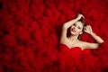 Fashion Model on Red Flounce Waves Background, Woman Beauty Royalty Free Stock Photo