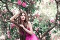 Fashion Model in Rhododendron Flowers, Beautiful Young Woman in Blooming Garden, Beauty Portrait Royalty Free Stock Photo