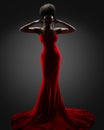 Fashion Model Silhouette in Red Long Dress. Stylish Female Portrait in Contour Light over Black Background. African Woman in dark