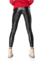 Shapely female legs in black leggings and boots isolated on white background Royalty Free Stock Photo