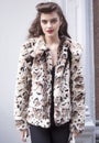 Fashion model Street Style wearing animal print coat during Fashion Week