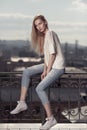 Fashion model. Summer look. Jeans, sneakers, sweater. Royalty Free Stock Photo