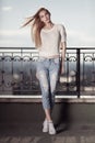 Fashion model. Summer look. Jeans, sneakers, sweater. Royalty Free Stock Photo