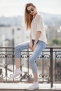 Fashion model. Summer look. Jeans, sweater, sunglasses. Royalty Free Stock Photo