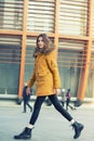 Fashion model walking and posing outdoor. Young blond caucasian woman posing winter outdoo. Beautiful girl Royalty Free Stock Photo