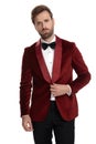 Fashion model wearing red velvet tuxedo on white background Royalty Free Stock Photo