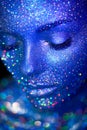 Portrait of beautiful woman with sparkles on her face Royalty Free Stock Photo