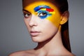 Fashion model woman with colored face painted Royalty Free Stock Photo