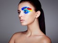 Fashion model woman with colored face painted Royalty Free Stock Photo