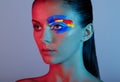 Fashion model woman with colored face painted Royalty Free Stock Photo