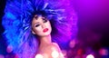 Fashion model woman in colorful bright lights posing. Portrait of beautiful girl with trendy makeup and colorful hairdo Royalty Free Stock Photo