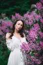 Fashion model, woman in lilac purple garden. Luxury fragrance concept Royalty Free Stock Photo