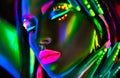 Fashion model woman in neon light. Beautiful model girl with colorful fluorescent makeup