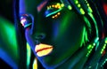 Fashion model woman in neon light. Beautiful model girl with colorful fluorescent makeup