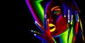 Fashion model woman in neon light. Beautiful model girl with colorful fluorescent makeup