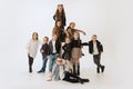 Group of beautiful kids, little girls and boys in modern outfits posing on grey studio background. Beauty, kids fashion Royalty Free Stock Photo