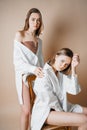 Fashion models two sisters twins beautiful nude girls looking at Royalty Free Stock Photo