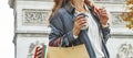 Fashion-monger with shopping bags having coffee and macaroon Royalty Free Stock Photo